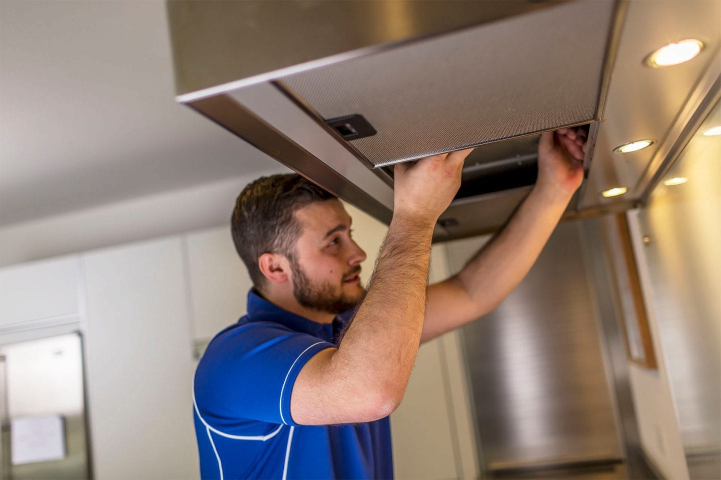 Kitchen hood installer fitting commercial canopy in Gloucester