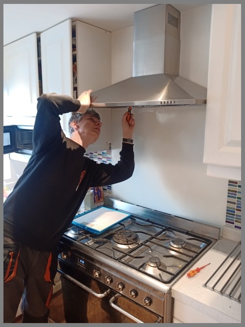 Kitchen hood installer in Gloucester preparing commercial extraction canopy